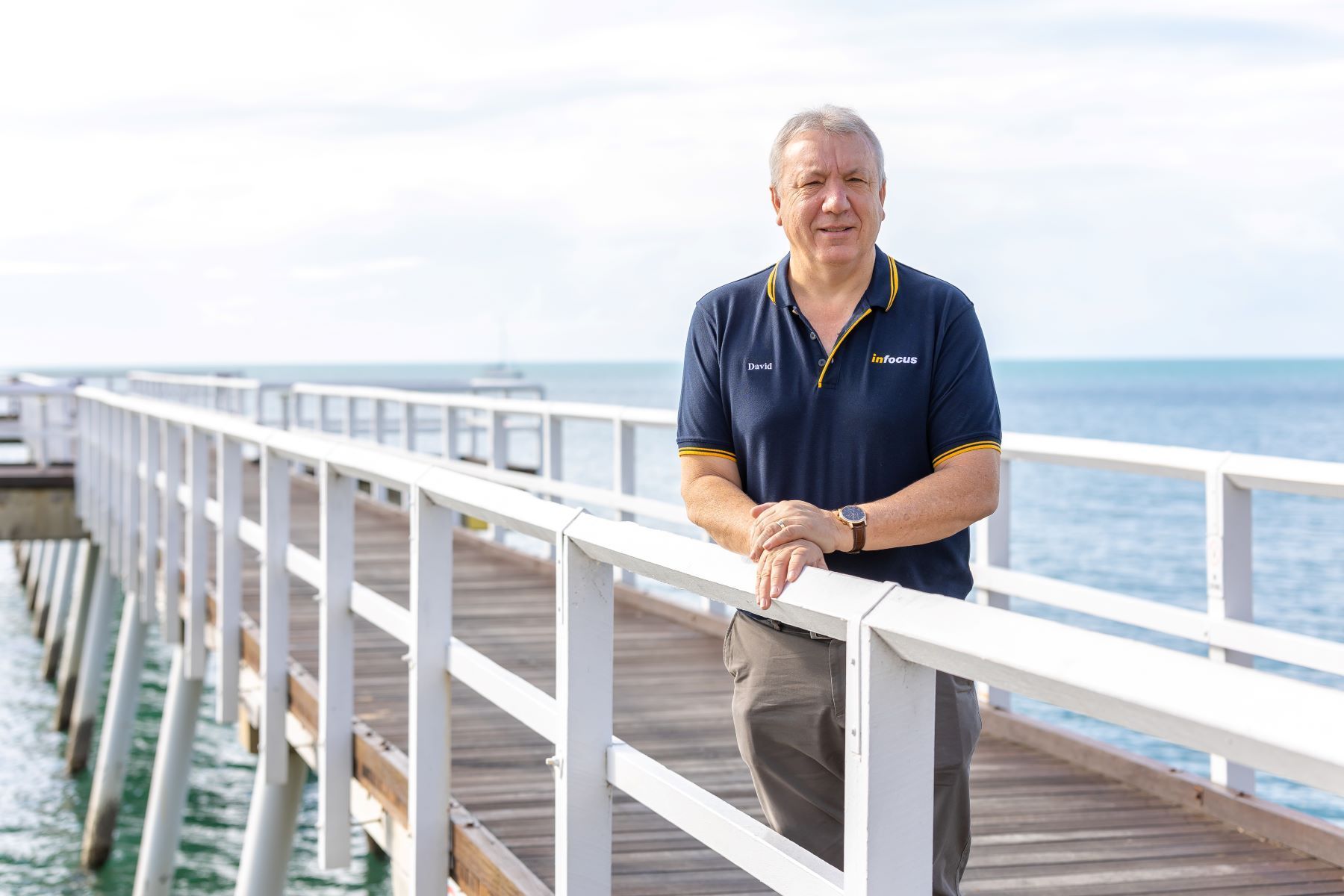 A Person Is Using A Calculator While Holding A Pen — Infocus Financial Advice Hervey Bay in Dundowran, QLD