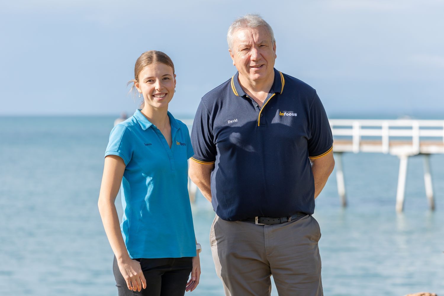 A Man Is Sitting At A Table Talking To A Man — Infocus Financial Advice Hervey Bay in Dundowran, QLD