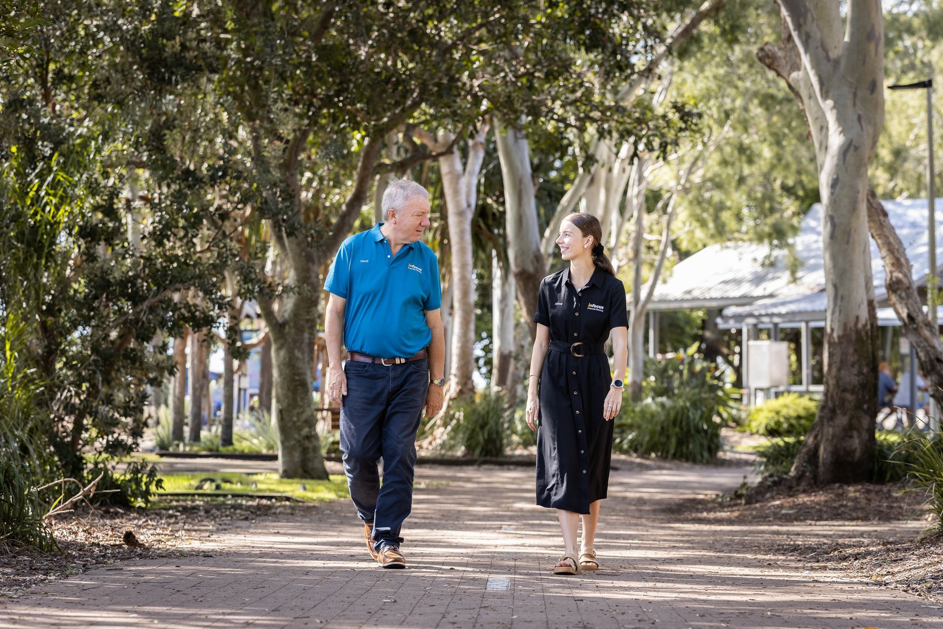 A Woman walking with Client — Infocus Financial Advice Hervey Bay in Dundowran, QLD