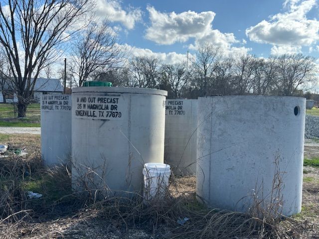 Four concrete tanks labeled