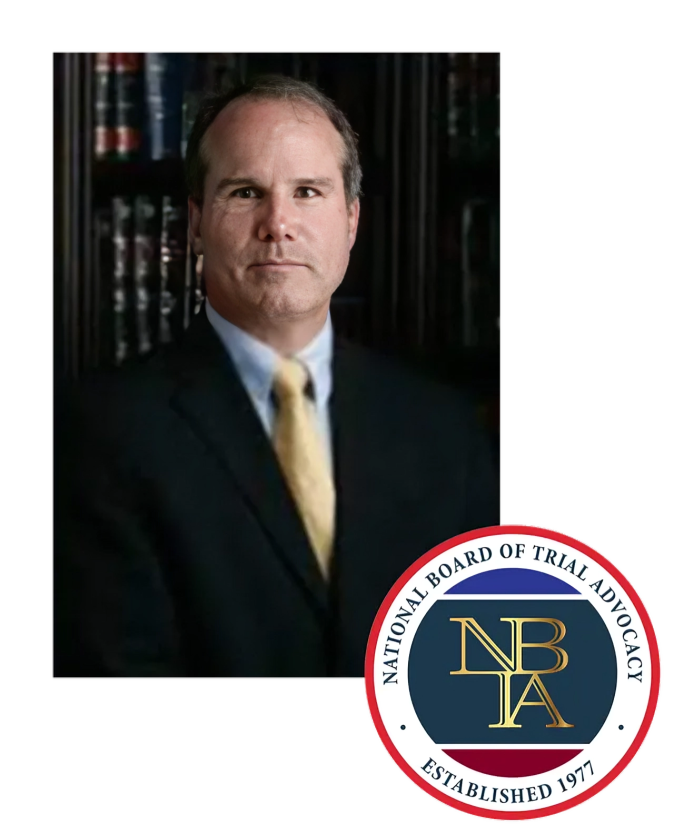 Man in suit and tie, with NBTA logo in corner.