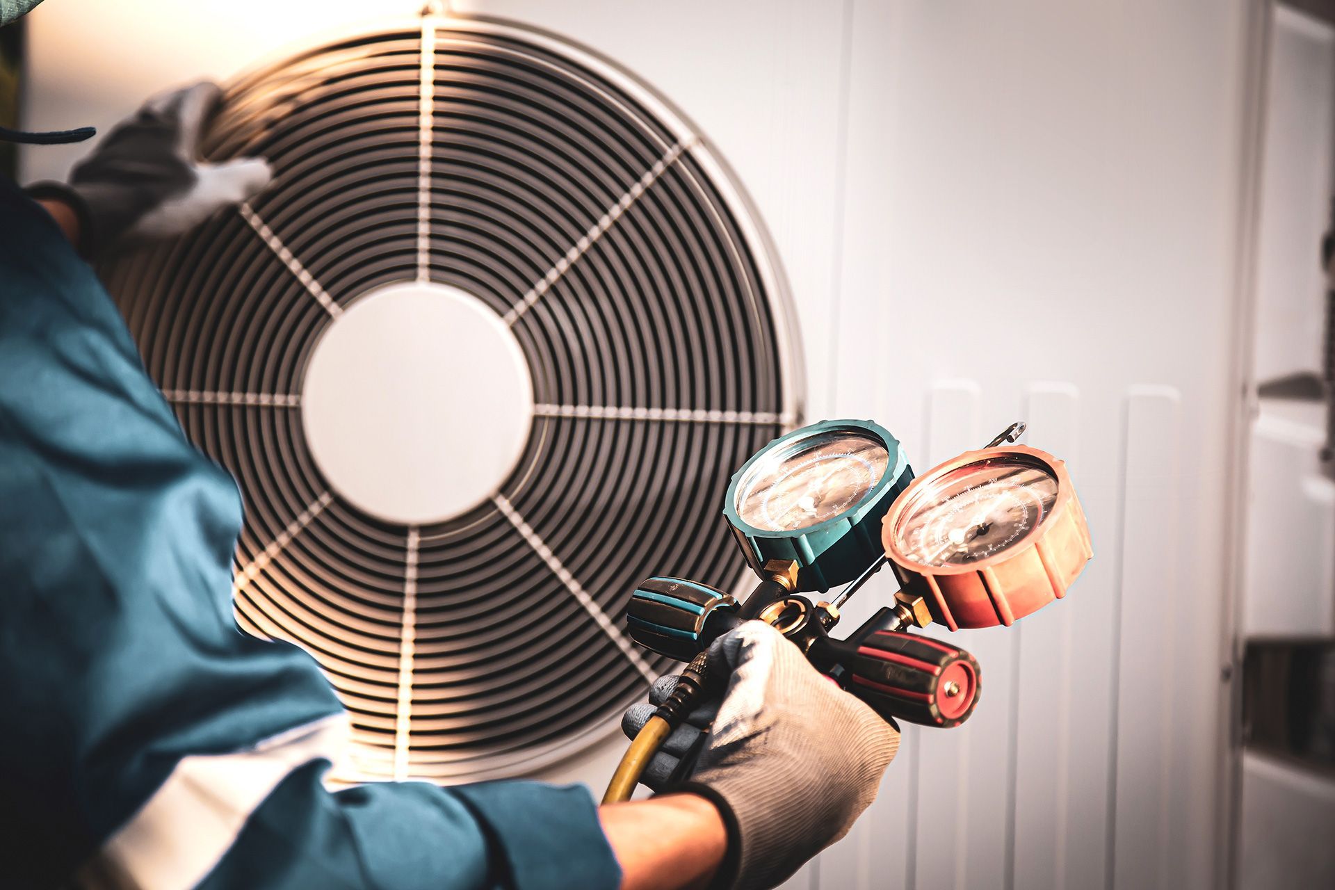 HVAC technician repairing air conditioning unit