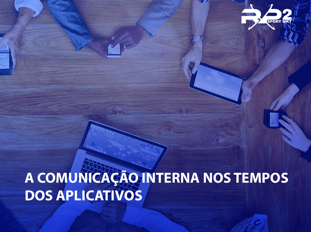 People using mobile devices around a wooden table. Text at the bottom reads 