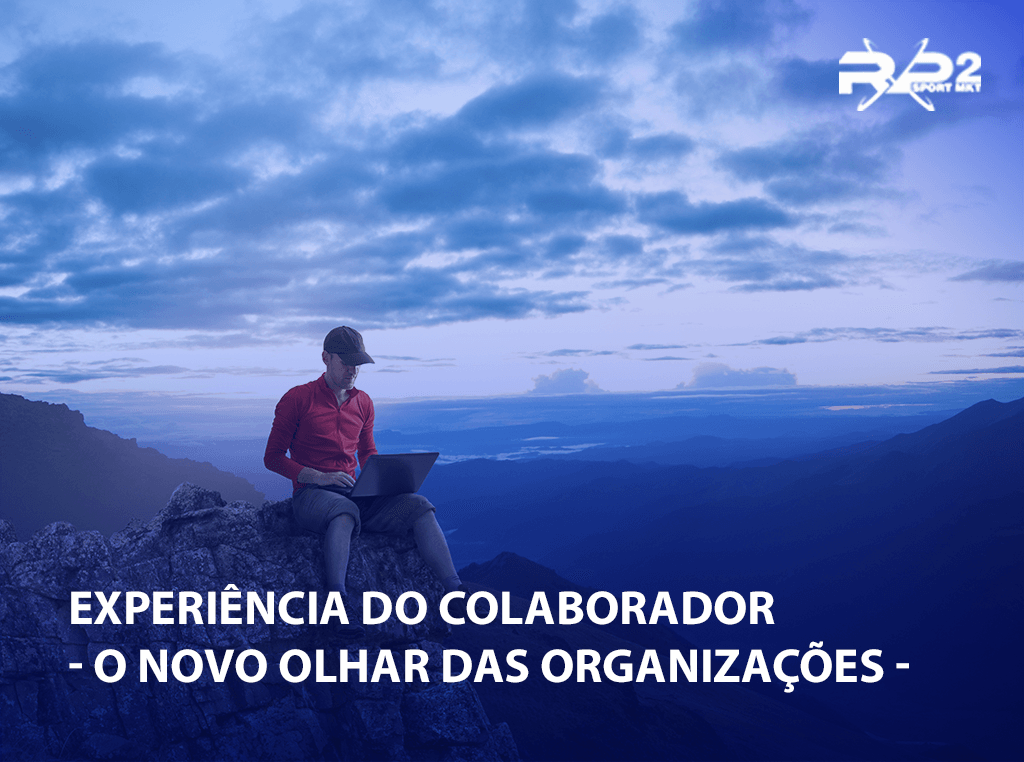 Uma pessoa com um laptop sentada em uma rocha com vista para montanhas e o texto diz