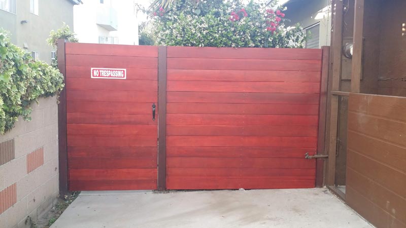 Red Wooden Fence and Gate — Installation in Inglewood, CA - King Dave Fence