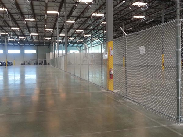 Indoor Parking Lot Chain Link Fence with Barbed Wire — Installation in Inglewood, CA - King Dave Fence