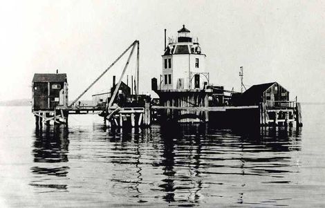 old photo of the construction pier built around the lighthouse