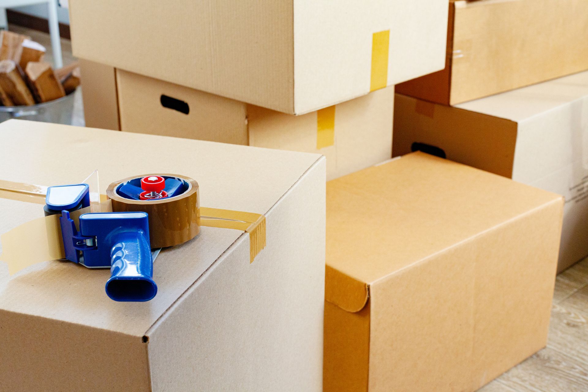 Cardboard boxes stacked in room by Classic Storage | storage units | Loveland, OH