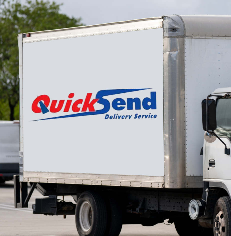 A white truck with the word quicksend on the side is parked in a parking lot.