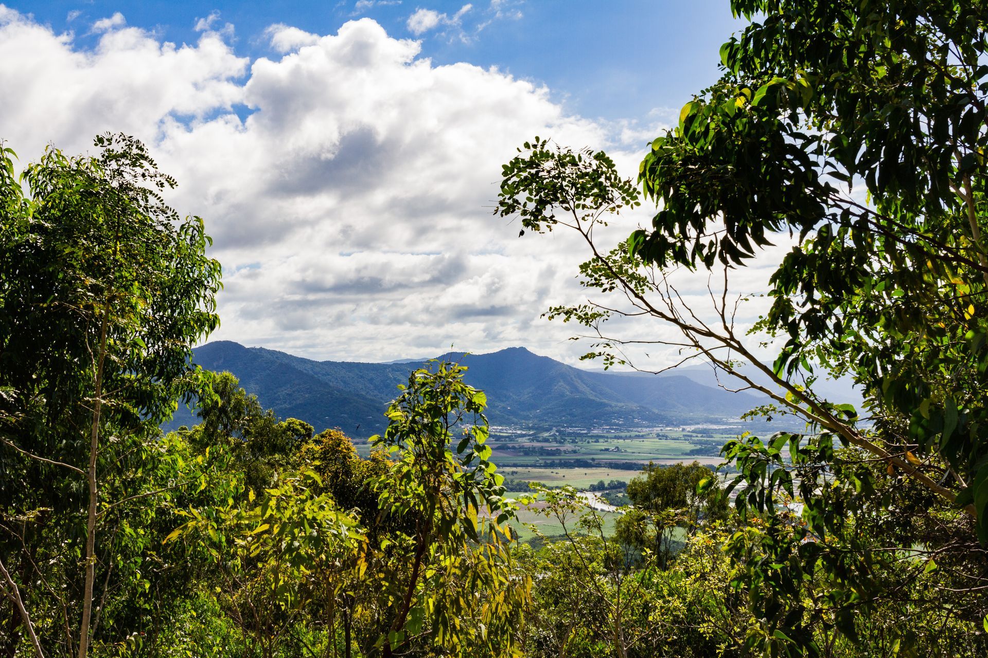 Cloudy skies and mountains — Rhino Excavator & Bobcat Hire in Whitfield, QLD