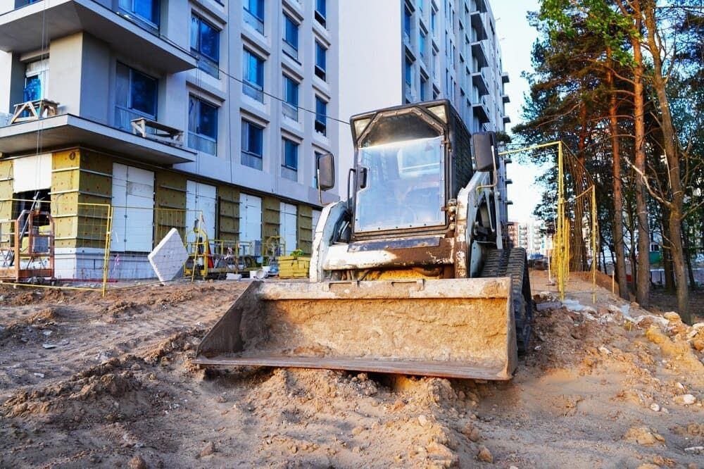 Construction Site With a Front-end Loader — Rhino Excavator & Bobcat Hire in Trinity Beach, QLD