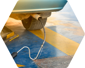 A car with a hose attached to the exhaust pipe