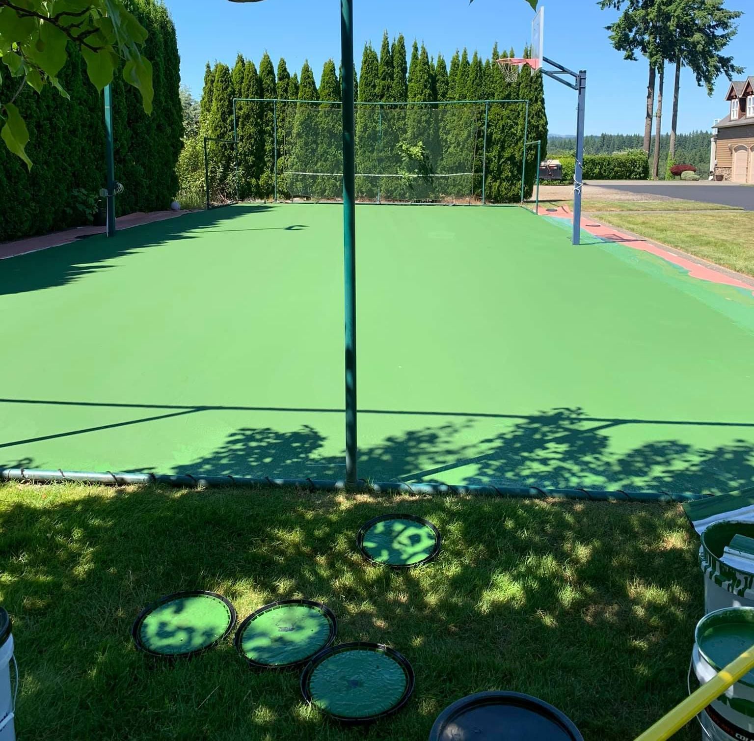 A green basketball court with the number 39 painted on the ground