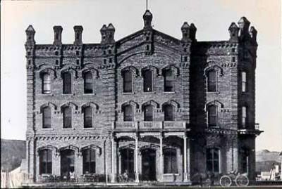 A black and white photo of a large brick building.