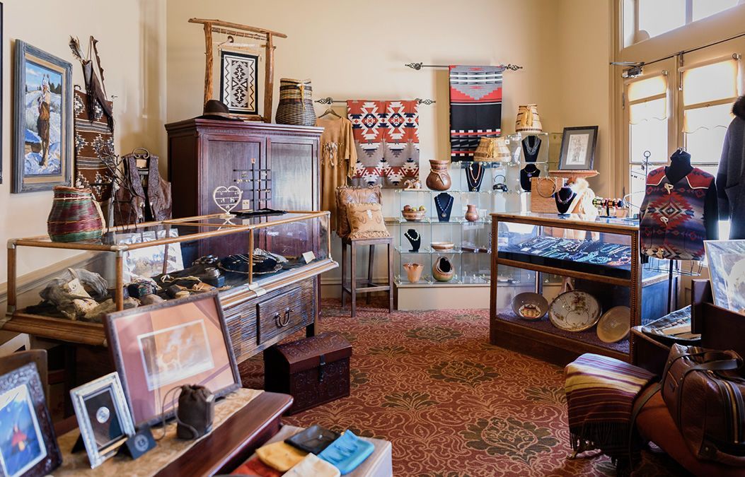 A living room filled with lots of furniture and displays