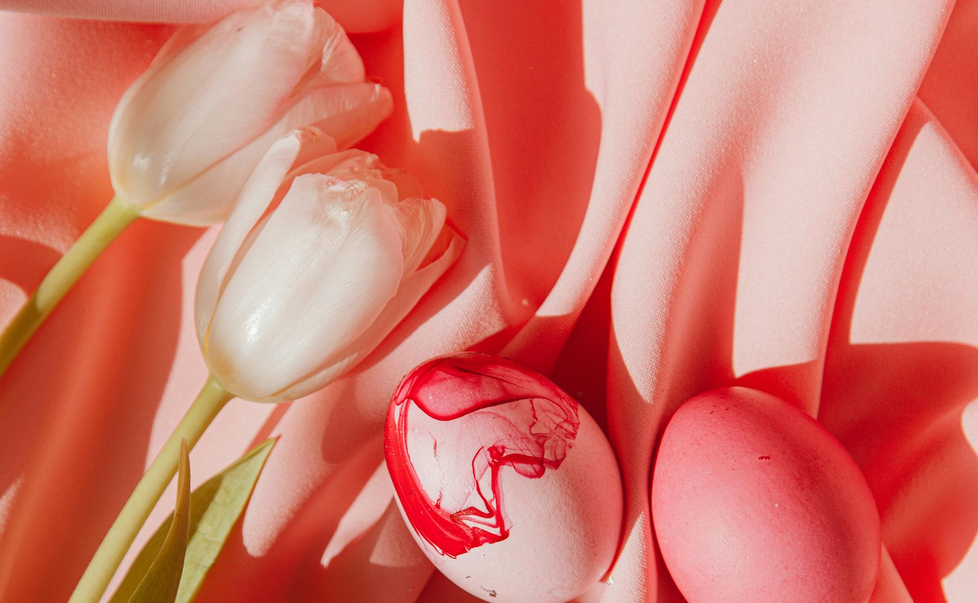 The word easter is made of easter eggs on a yellow background.