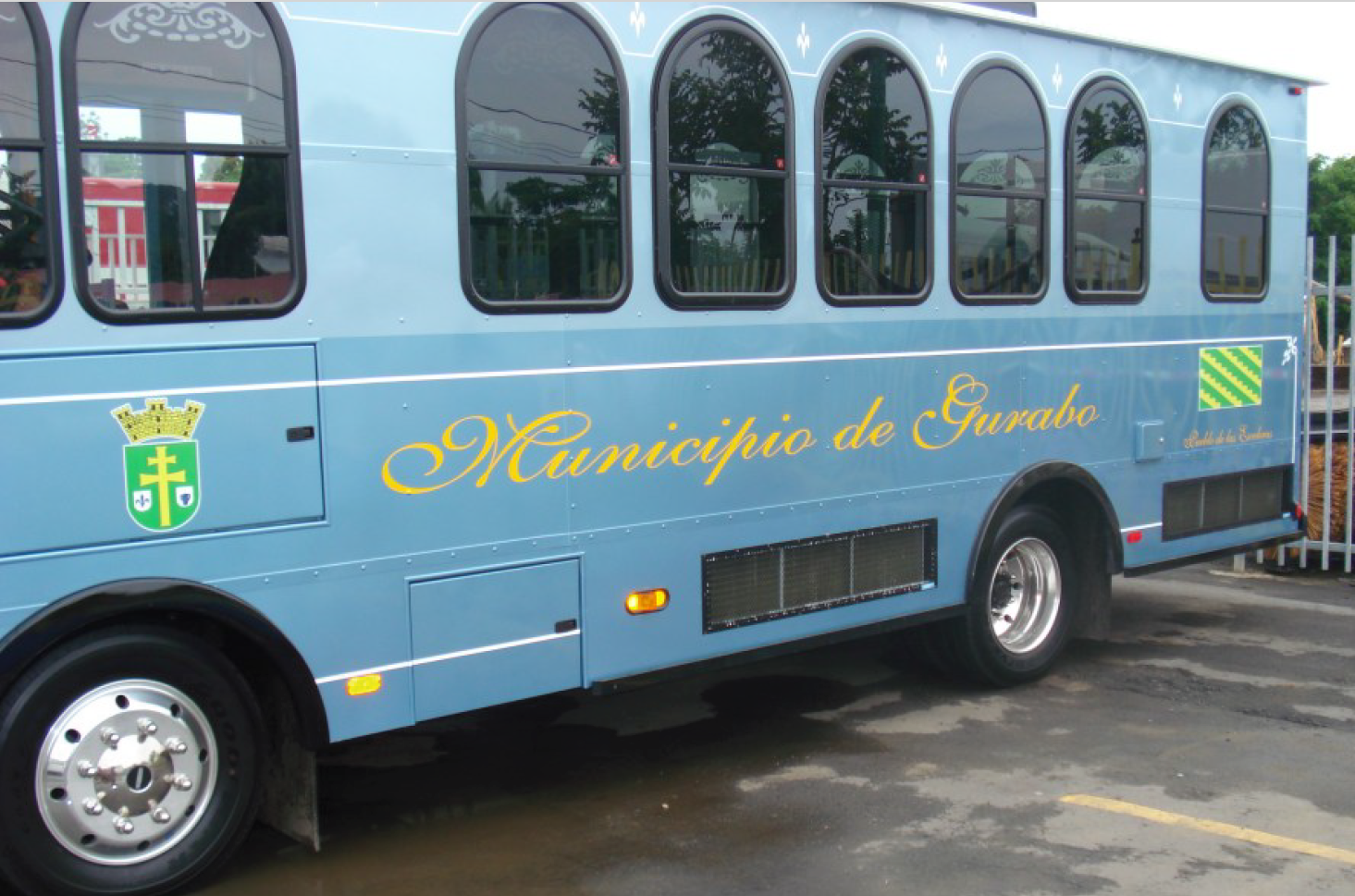 Passenger loading his bicycle on the front of bus