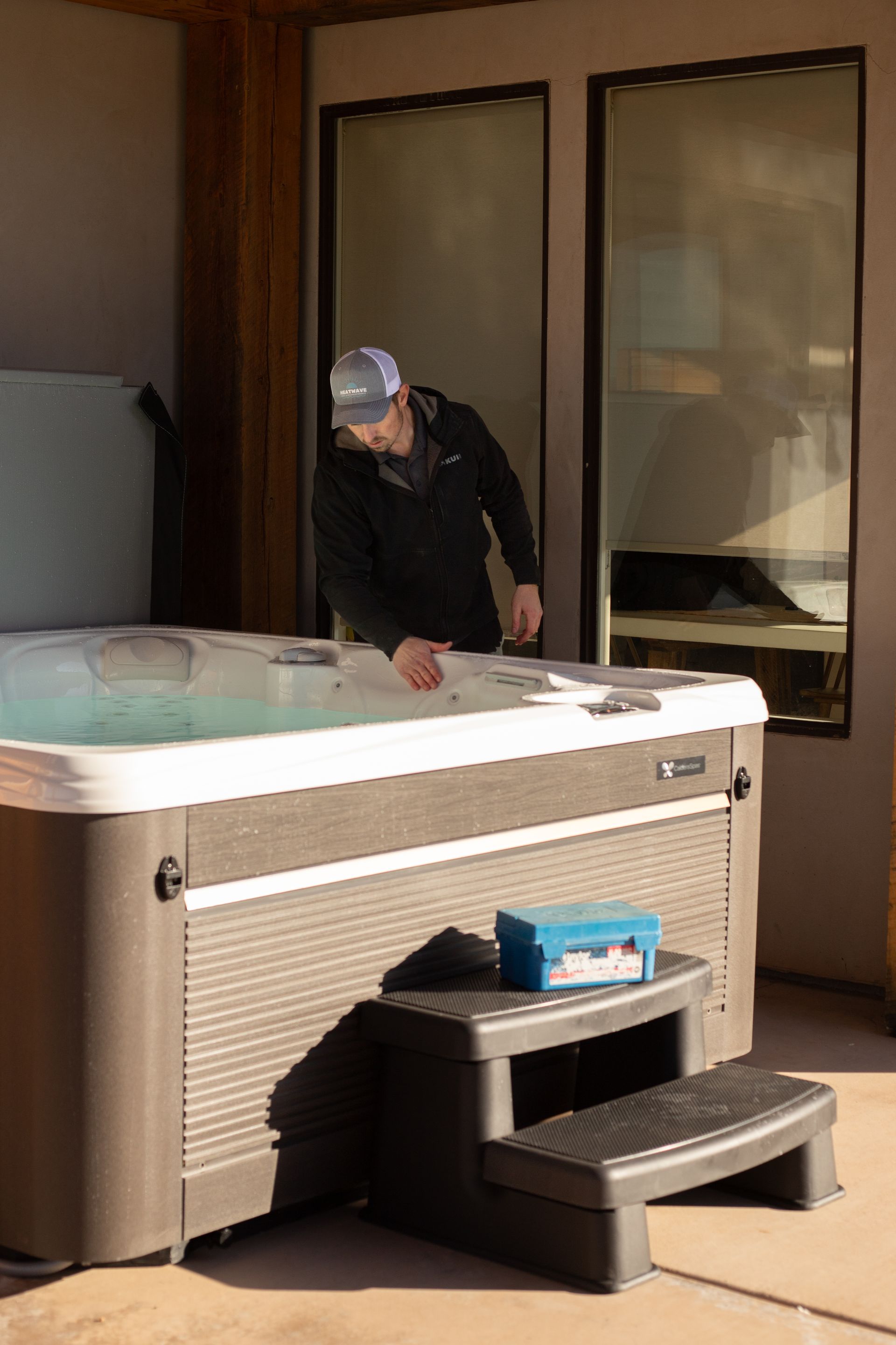 Heatwave pools and spas weekly spa maintenance in a Washington, Utah backyard.