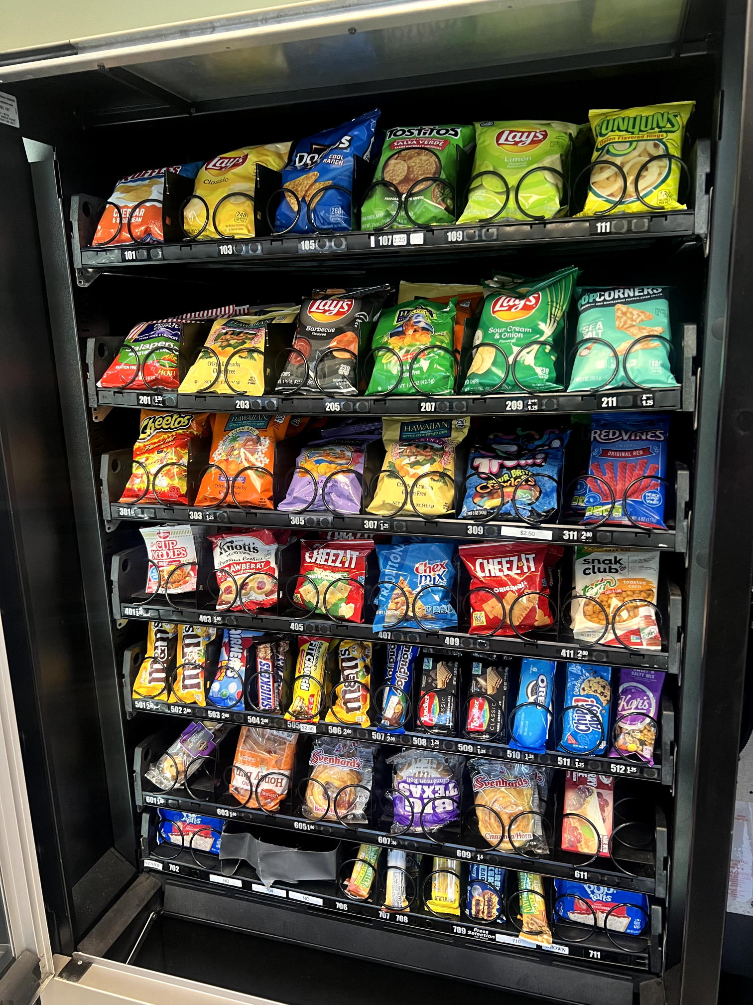 a vending machine filled with lots of different types of snacks