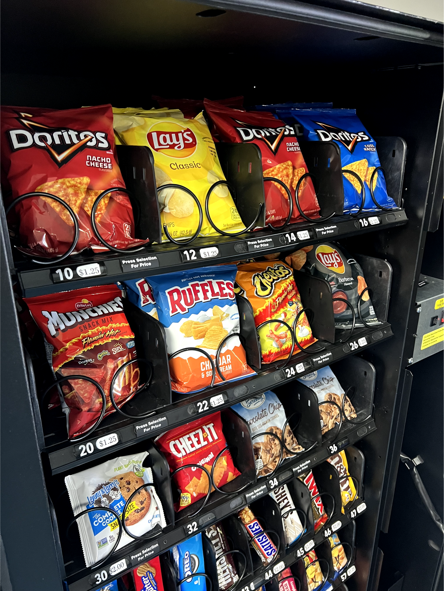 a vending machine filled with bags of chips and other snacks