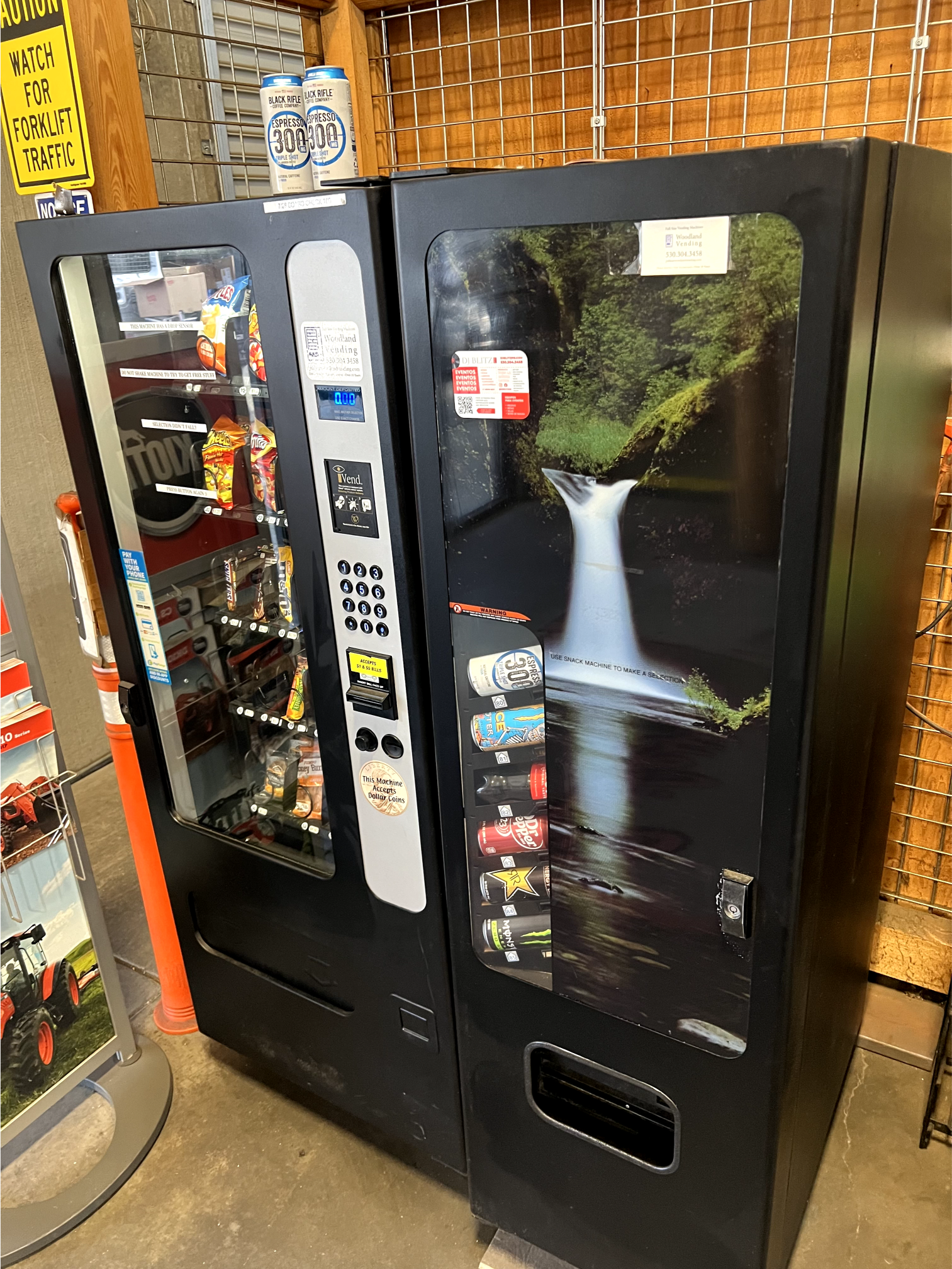 two vending machines are sitting next to each other in a room
