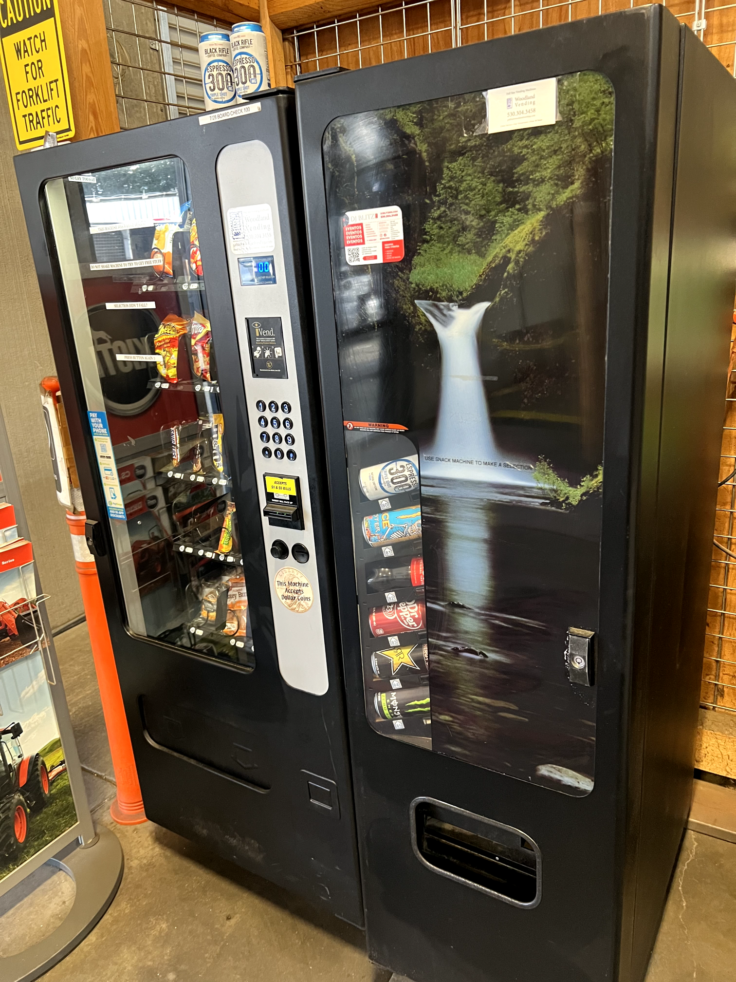 a vending machine with a waterfall on the front of it