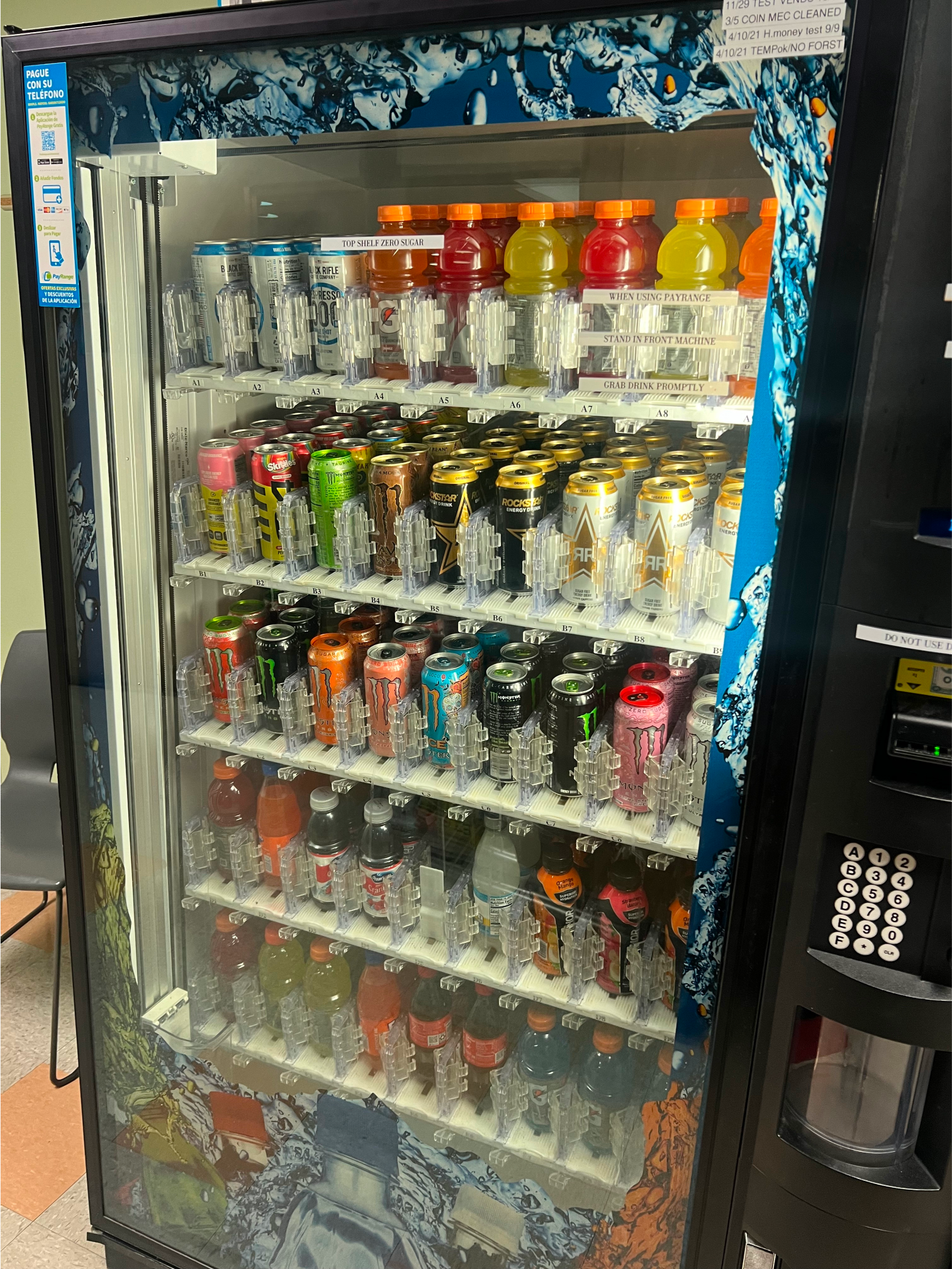a vending machine filled with cans and bottles of soda