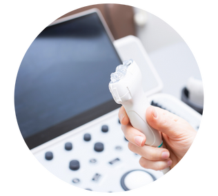 a person is holding a device in front of an ultrasound machine .