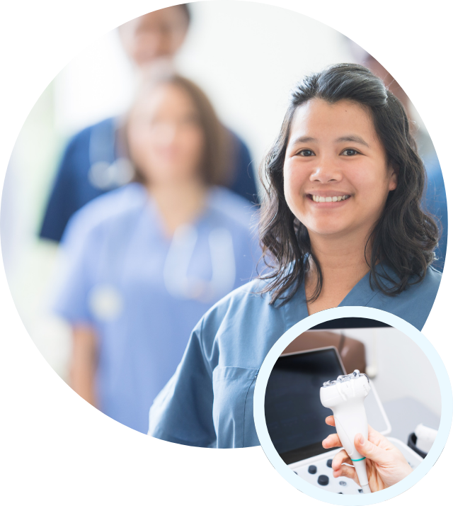 a nurse is smiling and holding an ultrasound machine