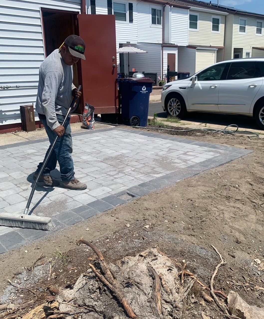 Worker Brushing The Pavement — Egg Harbor Township, NJ — EV Lawn and Landscape