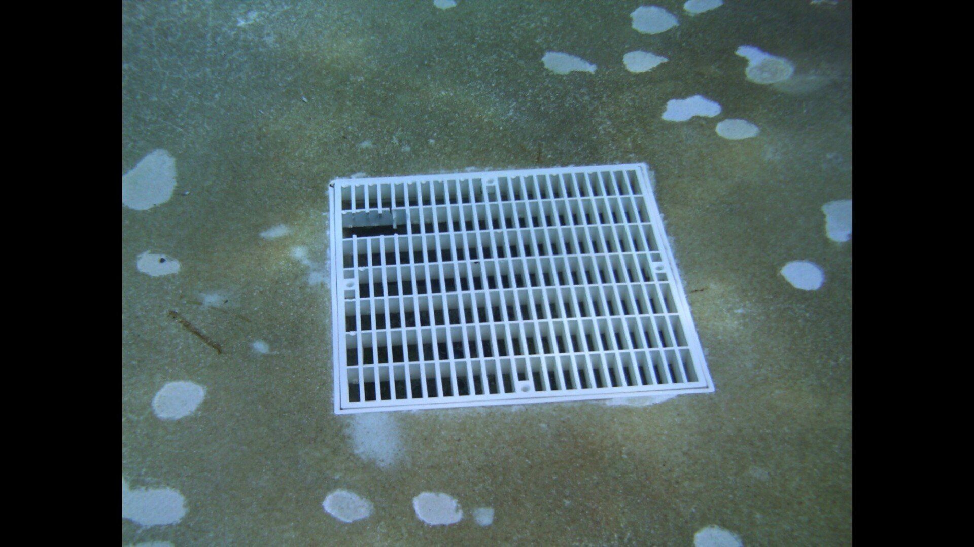 Brown Flooring With Swimming Pool Drain | Denair, CA | JG Underwater Pool Service