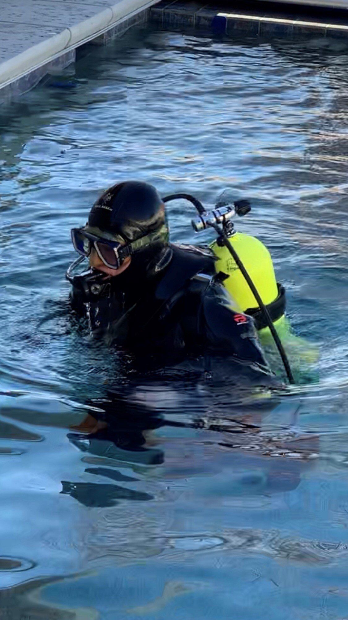 A Worker Welds Plastic Cover | Denair, CA | JG Underwater Pool Service