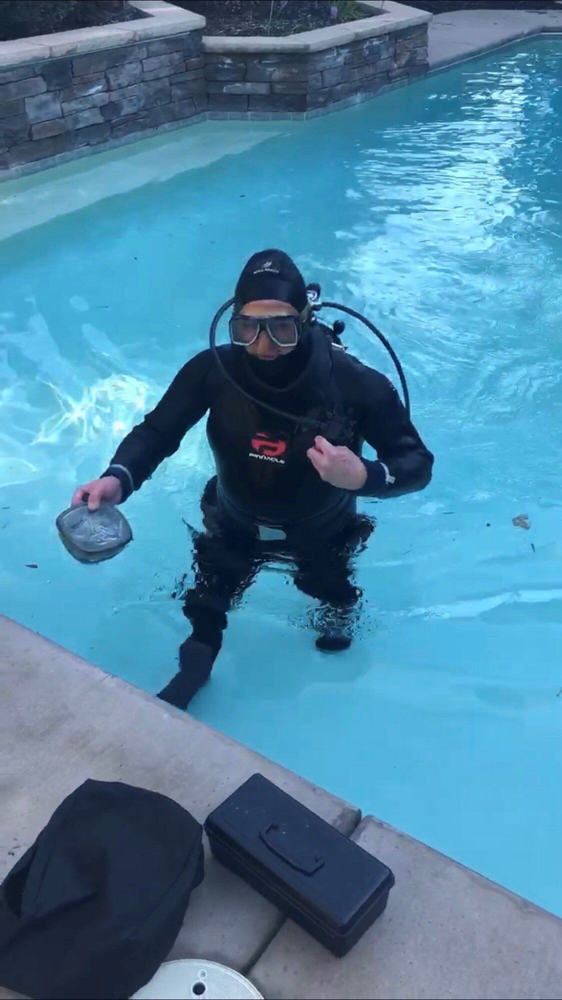 Scuba Diver Holding Plastic Tub | Denair, CA | JG Underwater Pool Service
