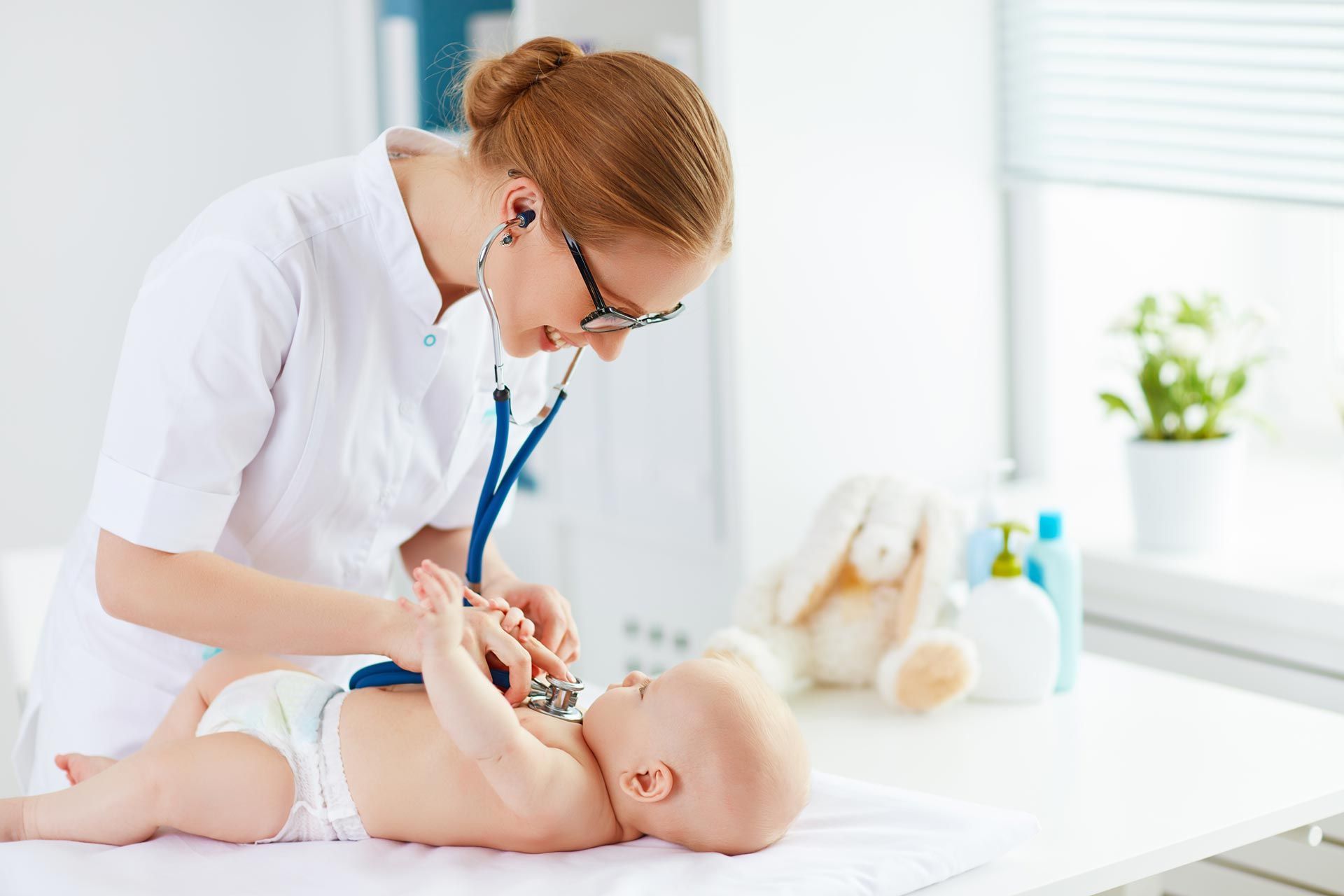 Doctor pediatrician and baby patient Doctor pediatrician and baby patient