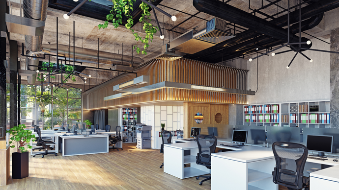 A large empty office with lots of desks and chairs.
