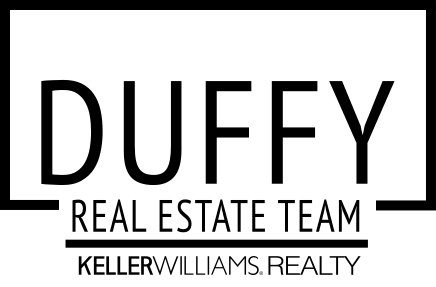The logo for the duffy real estate team is black and white.