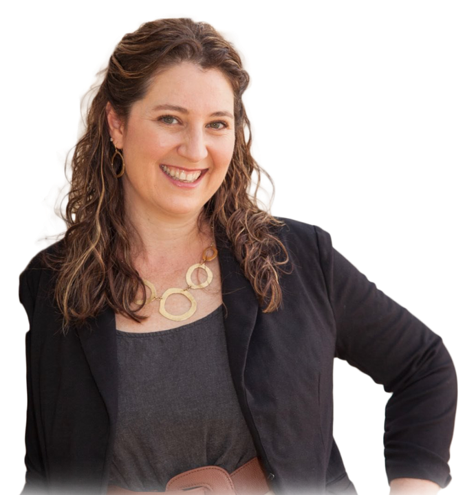 A woman wearing a black jacket and a necklace smiles for the camera