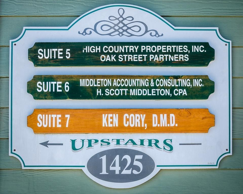 Sign with suite numbers and business names: High Country Properties, Middleton Accounting, and Ken Cory, D.M.D.