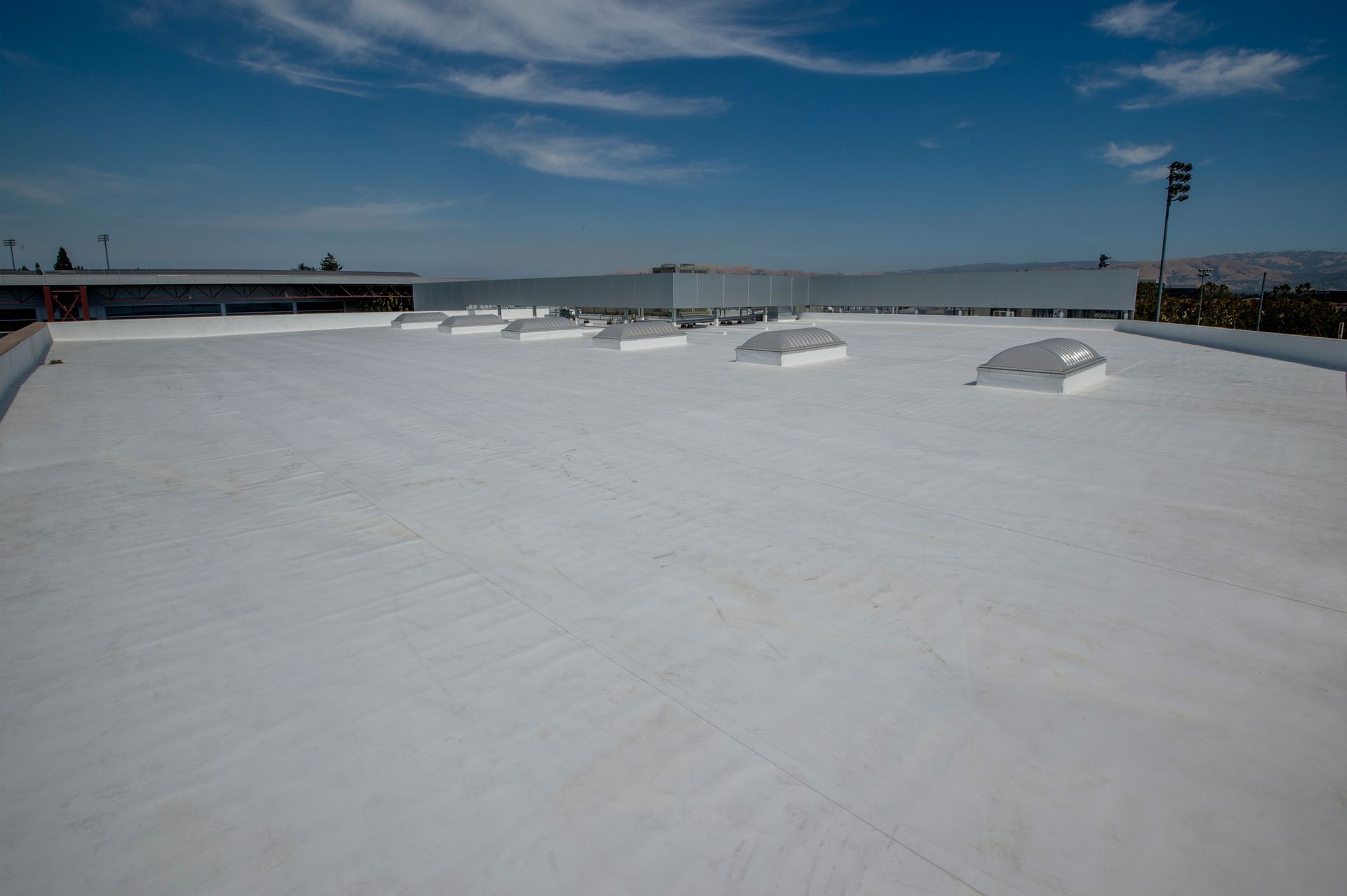 A white roof with a blue sky in the background