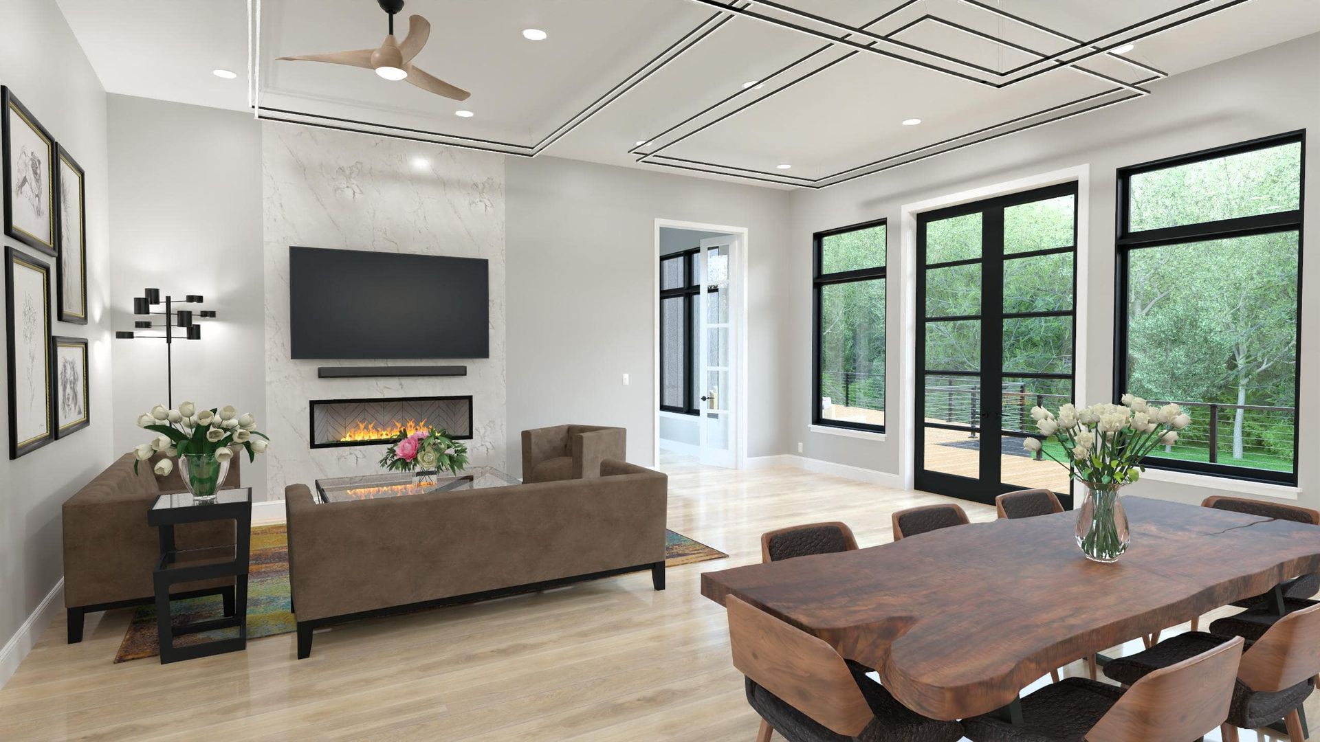 Living room with fireplace, TV, dining table, and large windows overlooking a lush landscape.