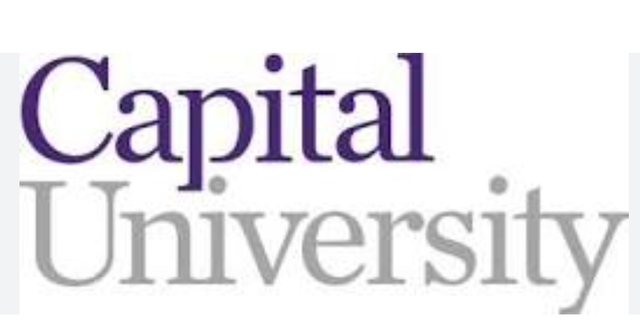 The logo for capital university is purple and white