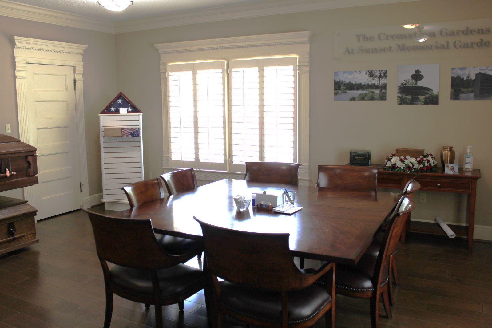 A conference room with a large table and chairs