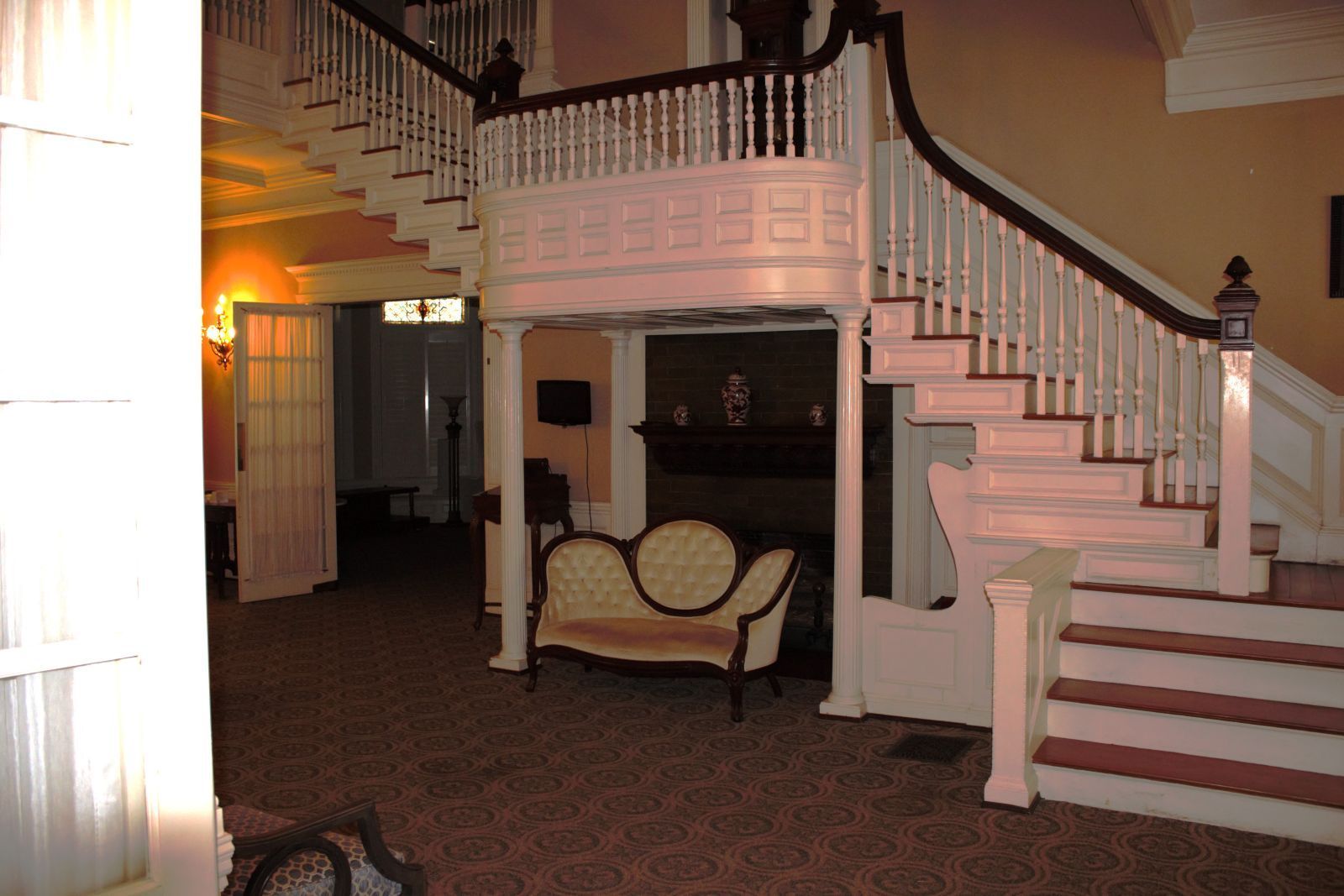 A staircase with a couch in the middle of it