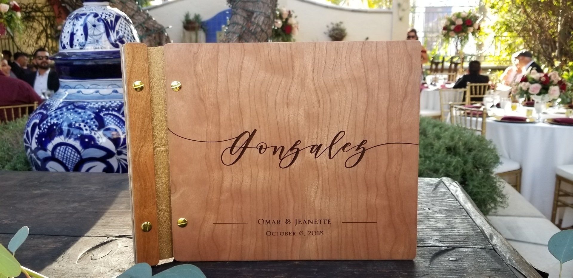 A wooden book with the name gonzález on it is sitting on a table.
