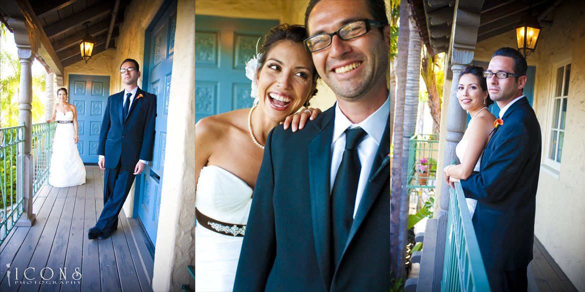 A bride and groom are posing for a picture on a balcony.