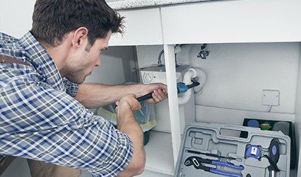 Plumber Fixing Sink In Kitchen - Open up sink in Hammond, IN