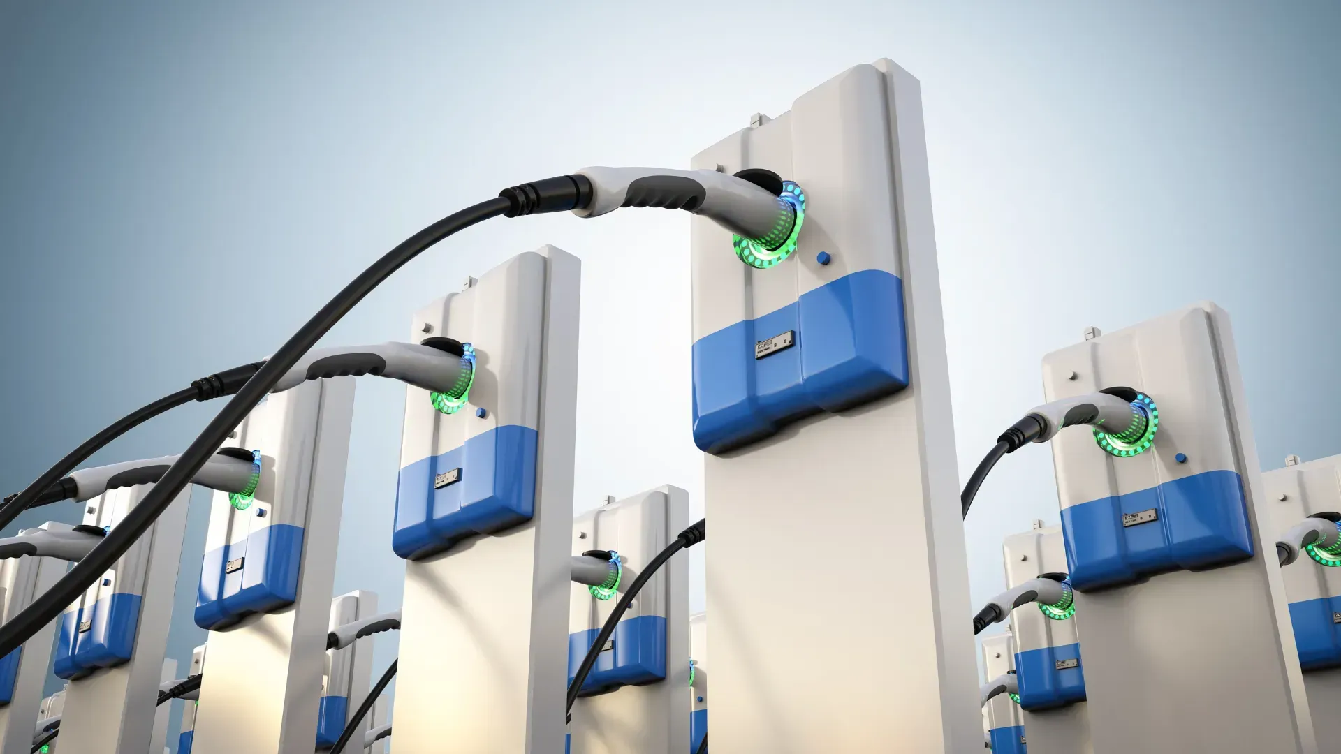 A bunch of electric cars are being charged at a charging station.