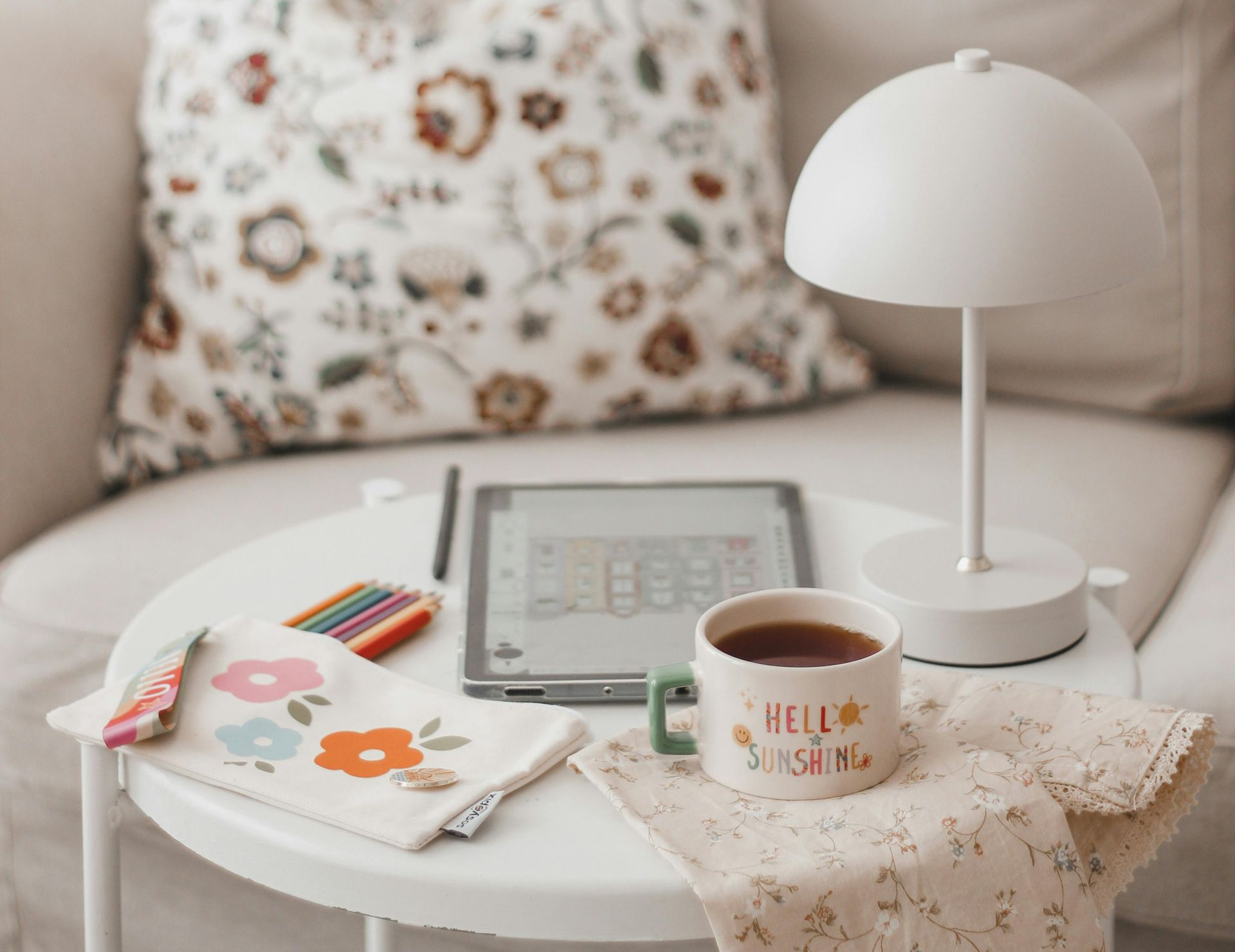 A couch with a coffee table and lamp