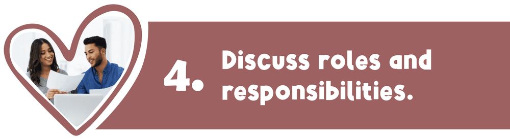 Two people looking at a laptop in a heart-shaped frame. Text: Discuss roles and responsibilities.