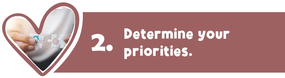 Hand holding a pregnancy test inside a heart-shaped frame; 